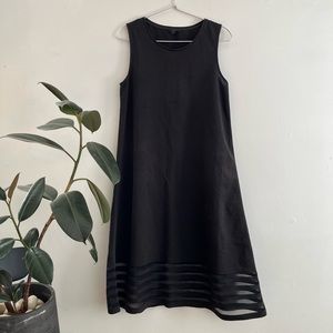 Black vest dress with see-through stripes at the bottom